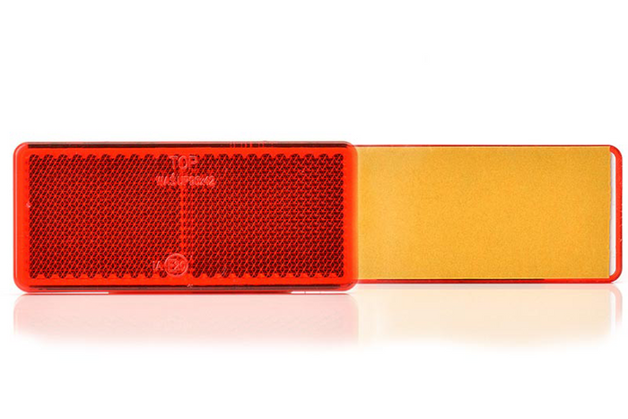 Catadioptre rouge 96 x 42 mm avec ruban adhésif